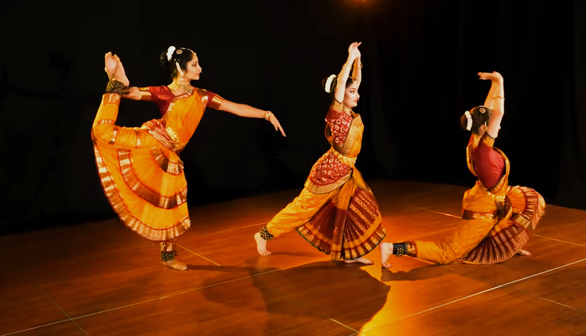 Bharatanatyam dancer in traditional costume performing