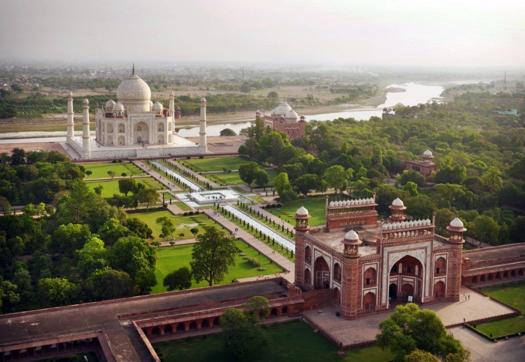 Emperor Shah Jahan with mustache and turban overseeing Taj Mahal construction, marble inlays, peacock throne in opulent court